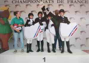 Les Quatre As sur le podium des Championnats de France